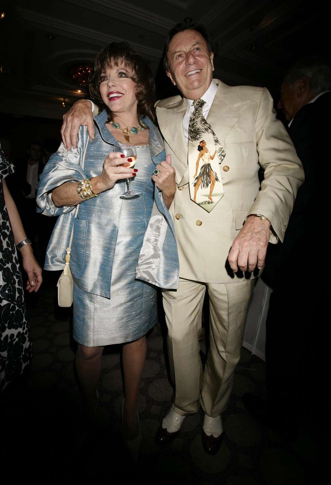 With Joan Collins in 2008 (PA)
