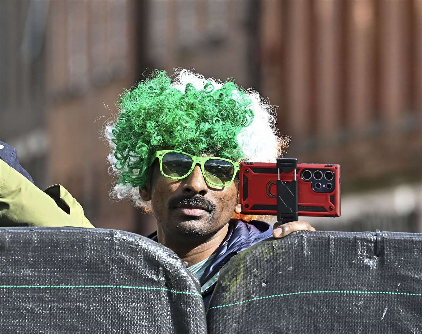 People gathered from early in the morning in their green and tricolour accessories (Michael Chester/PA)