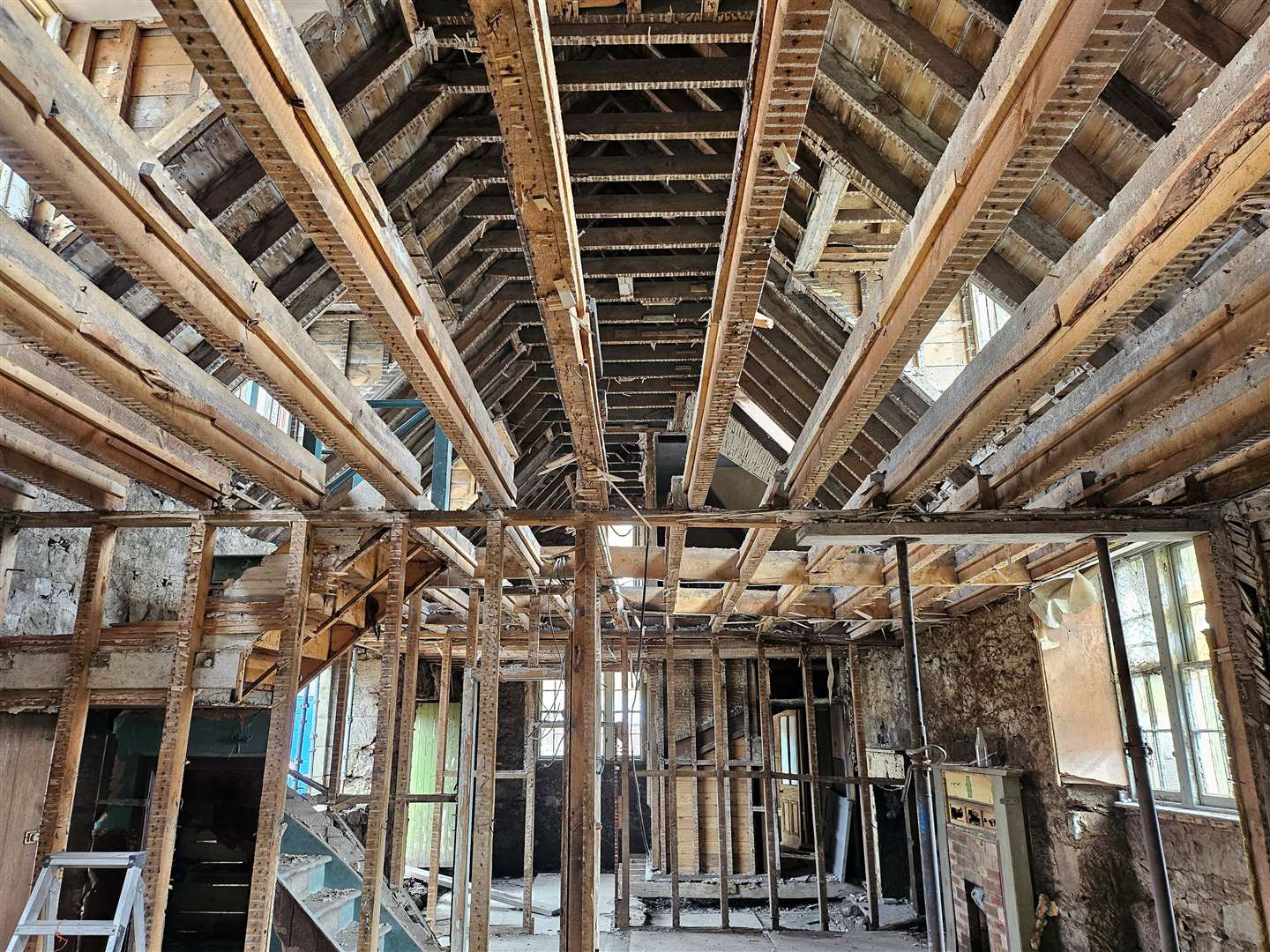 The interior of the building has been stripped out, with the floorboards and joints removed as well as the 1903 partition walls and lath on plaster walls.