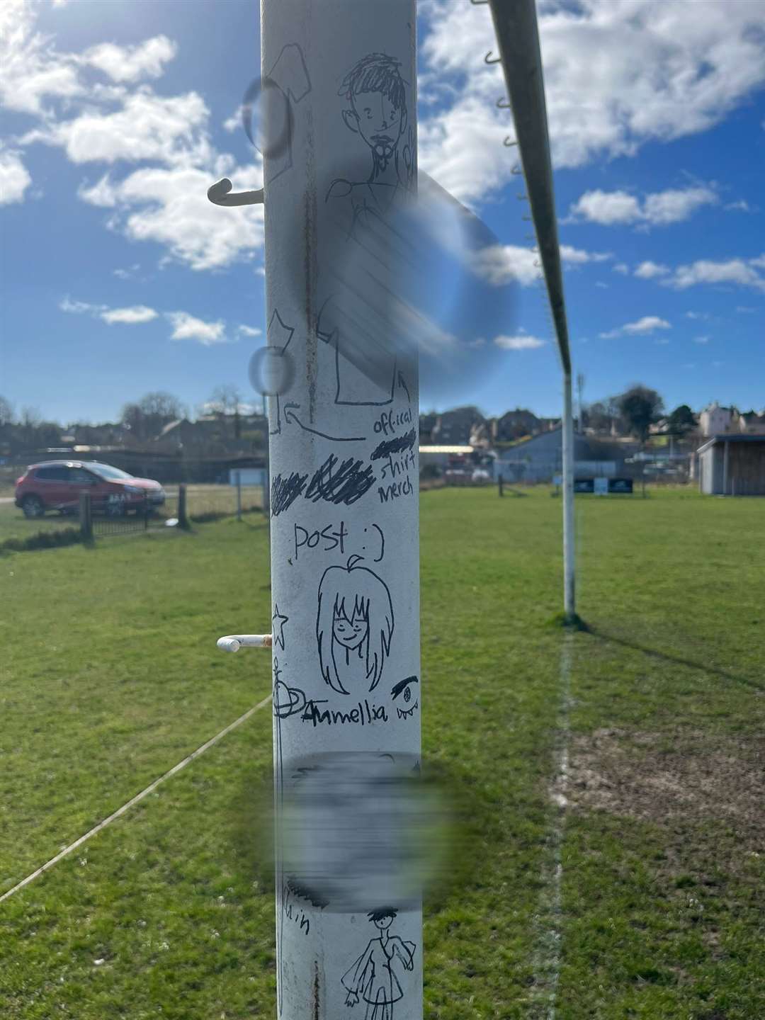Explicit graffiti has been applied to the park's goalposts using a marker pen.