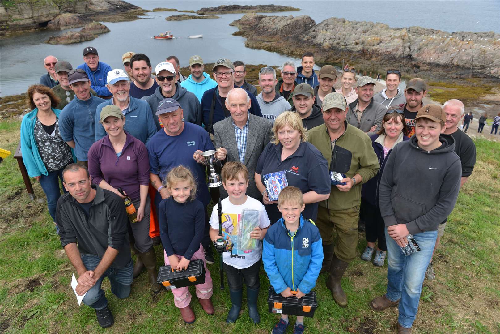 All of the anglers involved with prize winners in the front row together with William Macdonald, the senior member of the community who made the presentations.
