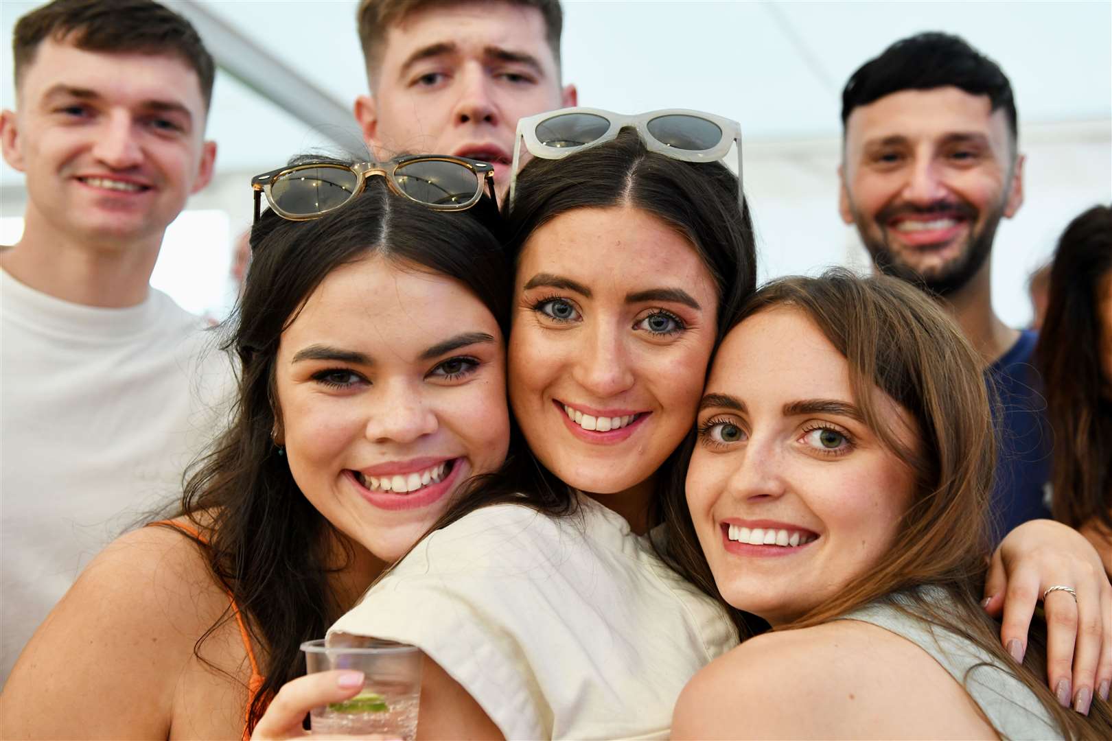 A group of festival-goers posing for a snapshot. © John Wright Studio