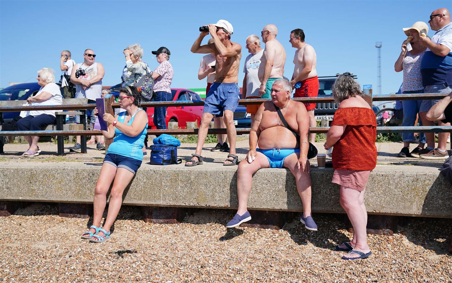 People watch as the container ship Ever Given arrives at the Port of Felixstowe (Aaron Chown/PA)