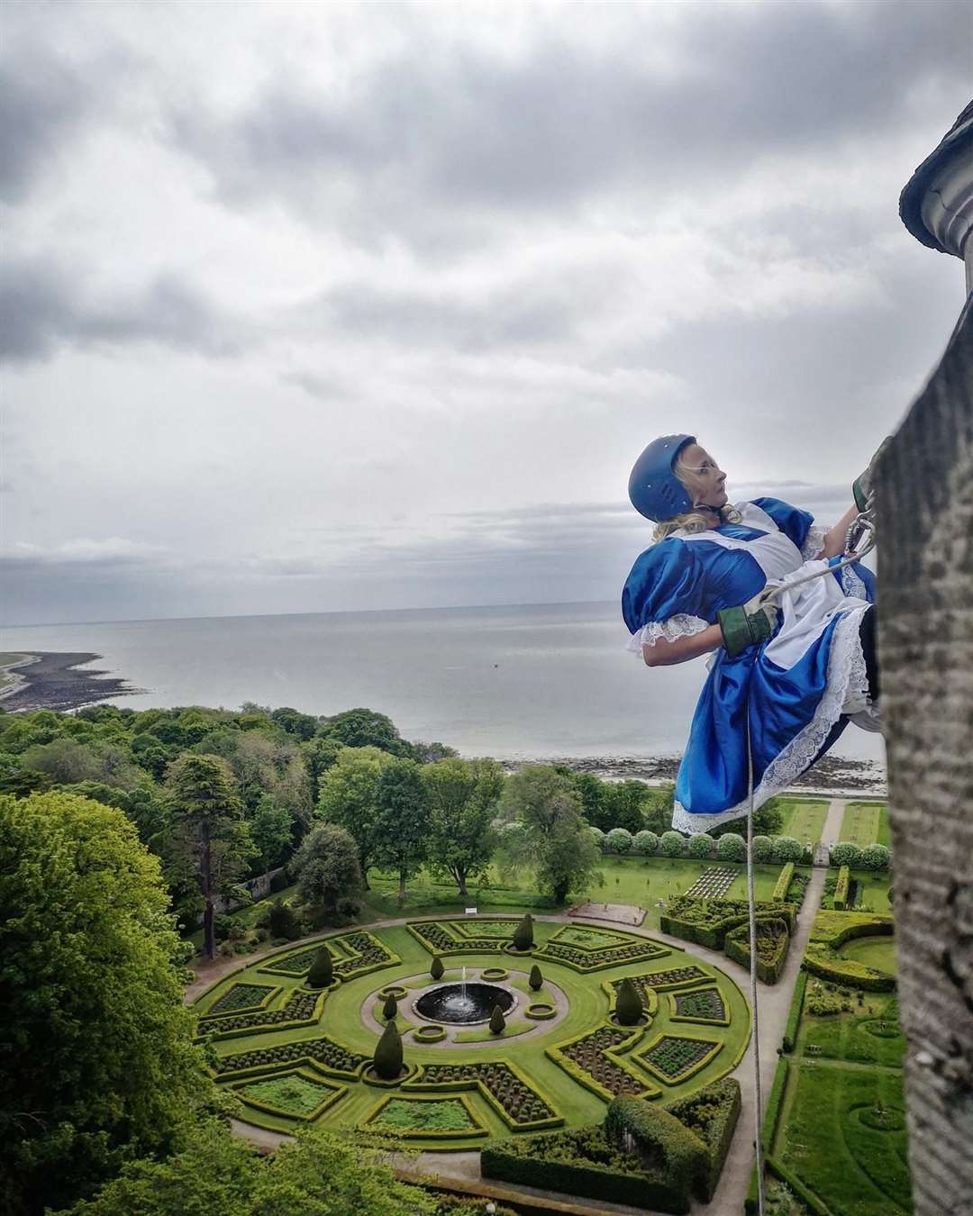 Mary Nimmo, chairwoman of Archie Highland's management committee attempts an abseil from the highest tower of Dunrobin Castle.