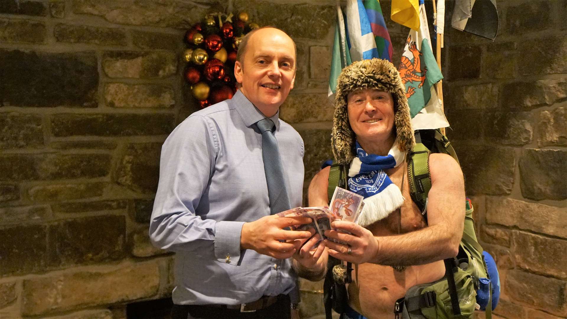 Andrew Mackay, owner of the Norseman Hotel, was delighted that Speedo Mick was staying and gave him a donation of £100. Picture: DGS