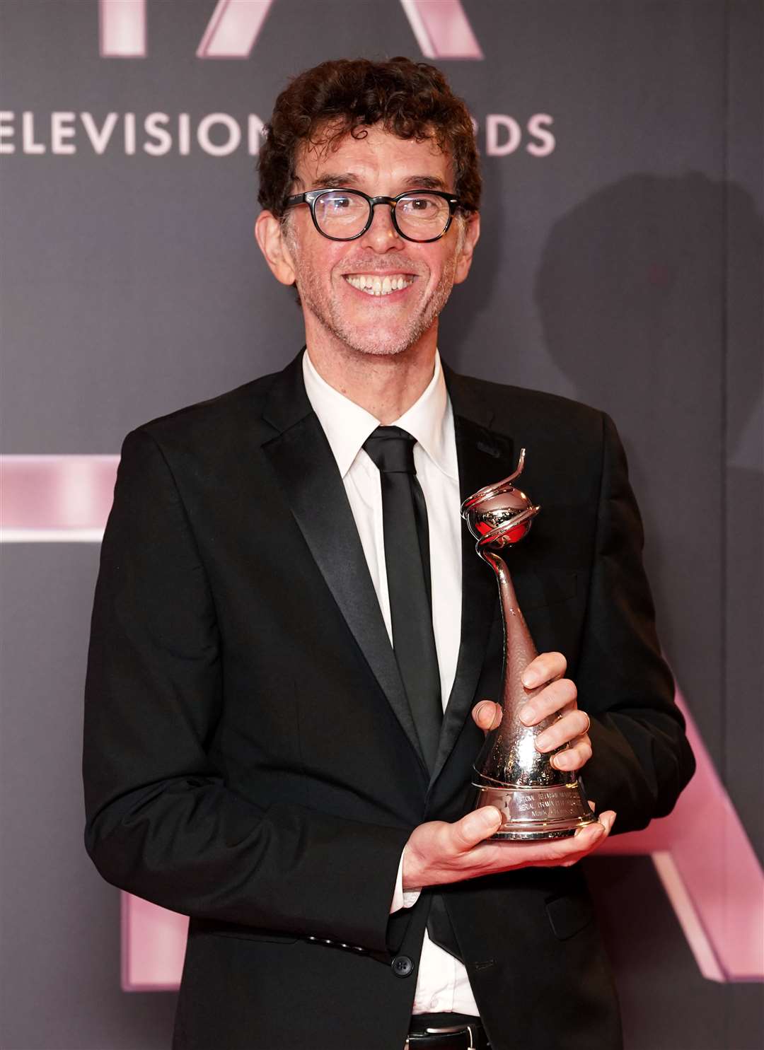 Mark Charnock in the press room after winning the Serial Drama Performance award for his role as Marlon Dingle in Emmerdale, at the National Television Awards 2022 (Ian West/PA)
