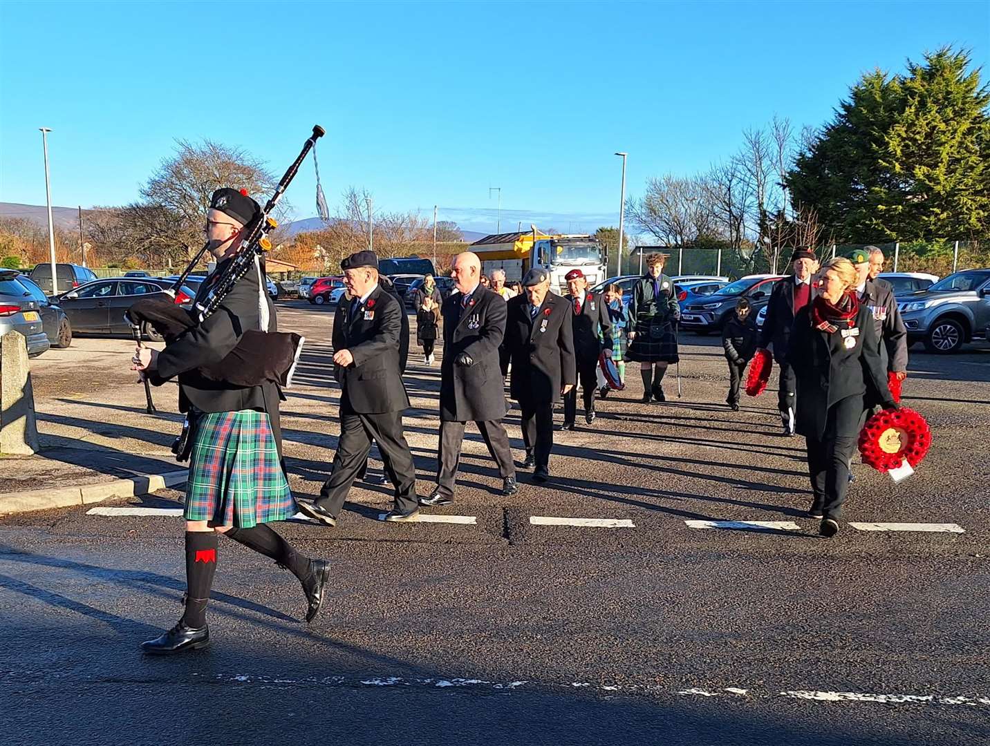 Piper Danny Parkin leads the parade from the Gower Street car park to the war memorial.