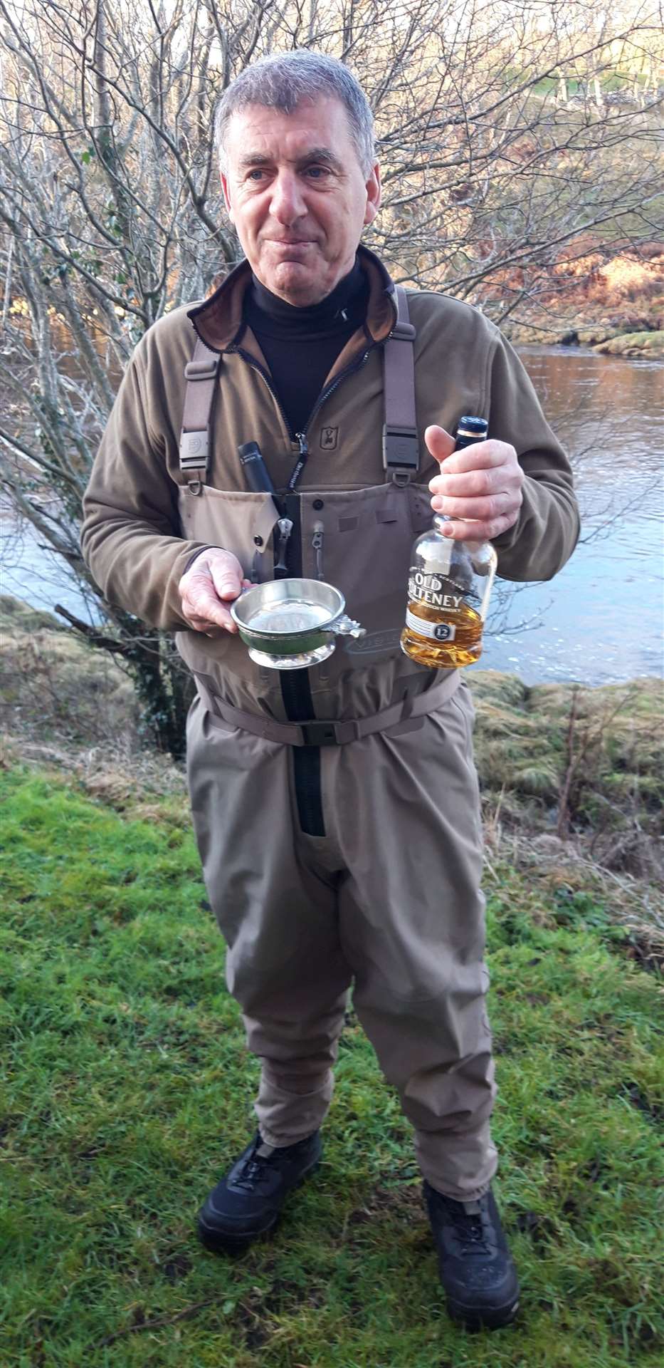 Ghillie Andy Sutherland (Torrish) with the quaich and whisky for the dram for the river.