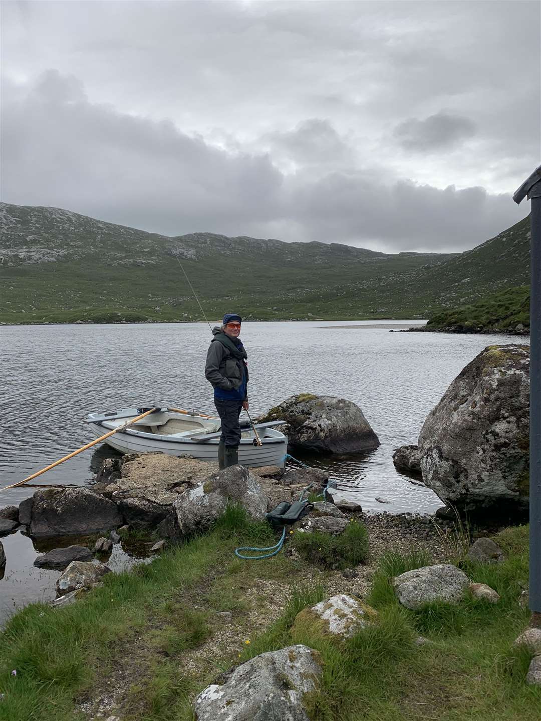 A fisherman about to head out on a Hebridean loch.