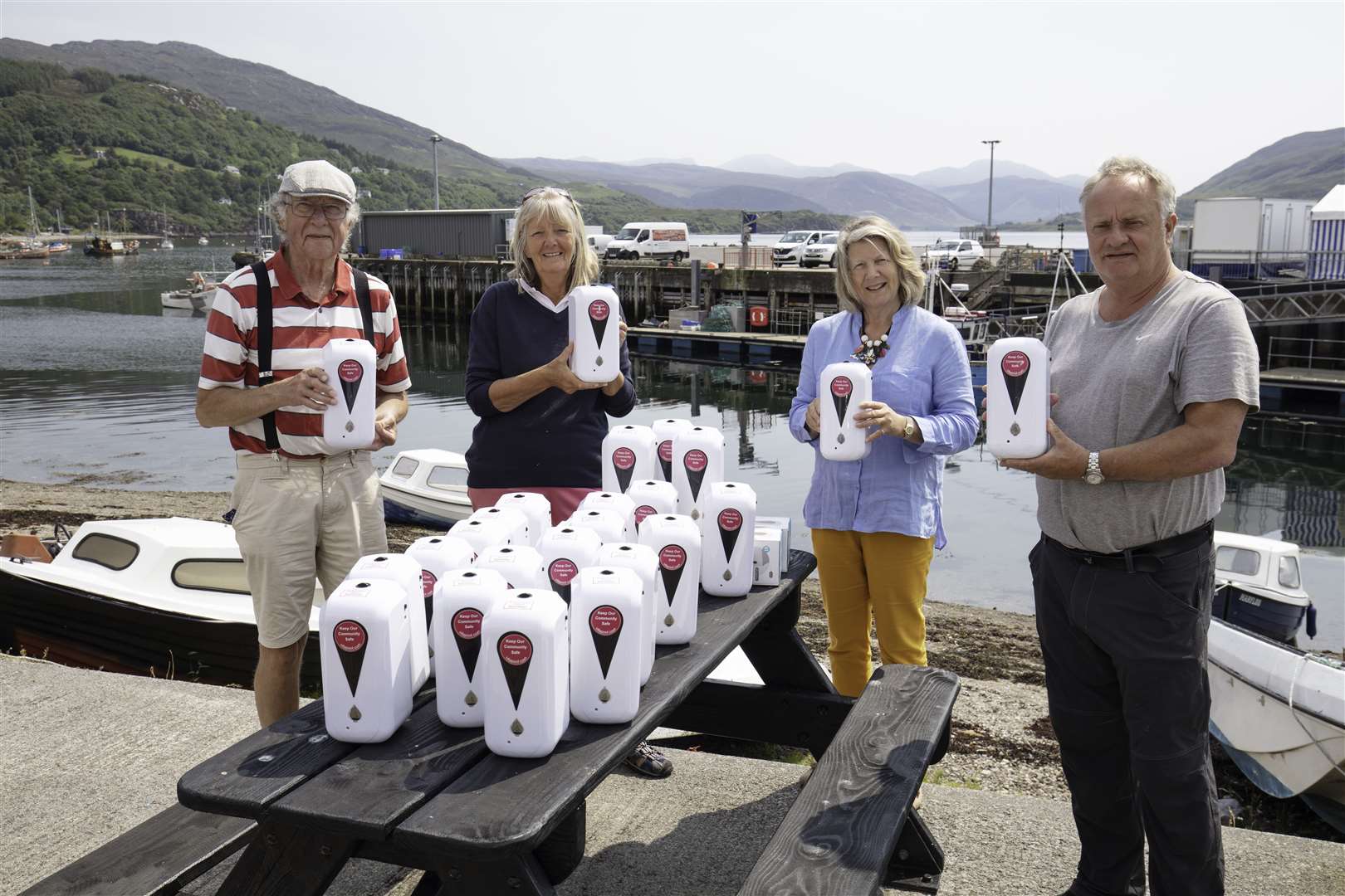 Pictured with the new hand sanitisers are Mike Turner, Secretary of Ullapool Golf Club, Angela Ford representing Welcome Ullapool, Katrina Thomson of the Captain’s Cabin and Charlie MacRae from Riverside Guest House.