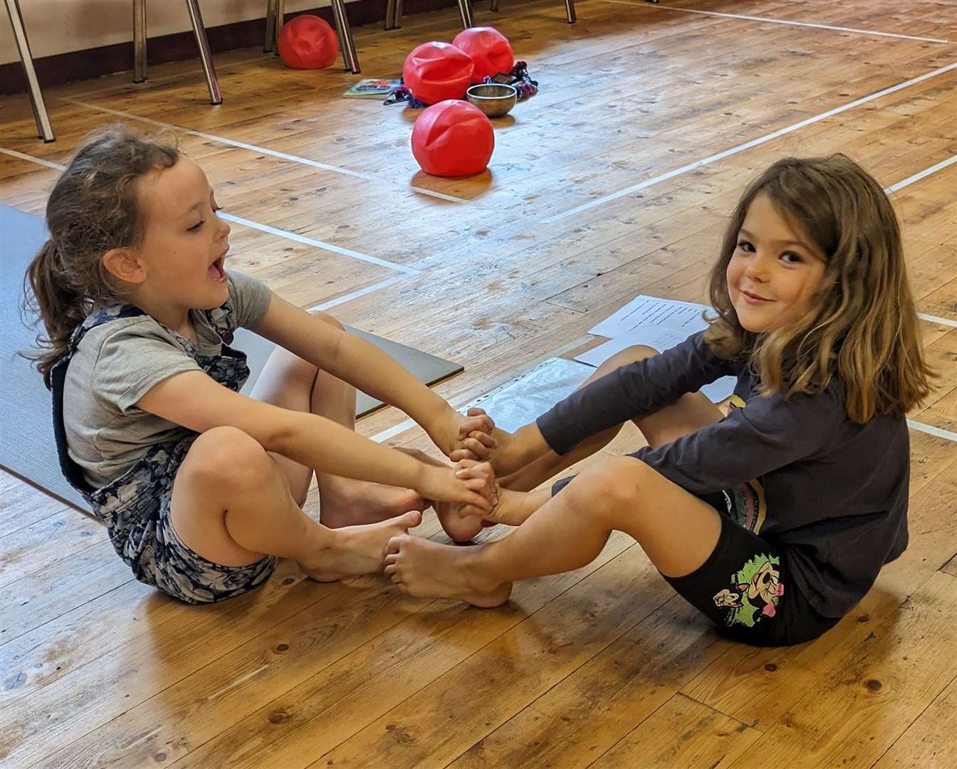 Violet Stevenson and Flora Murray took part in a family yoga session at Invershin Hall.