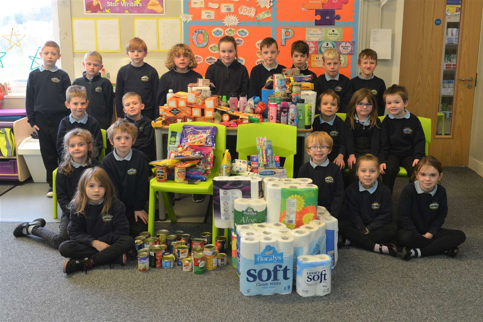 The children with the donated items.