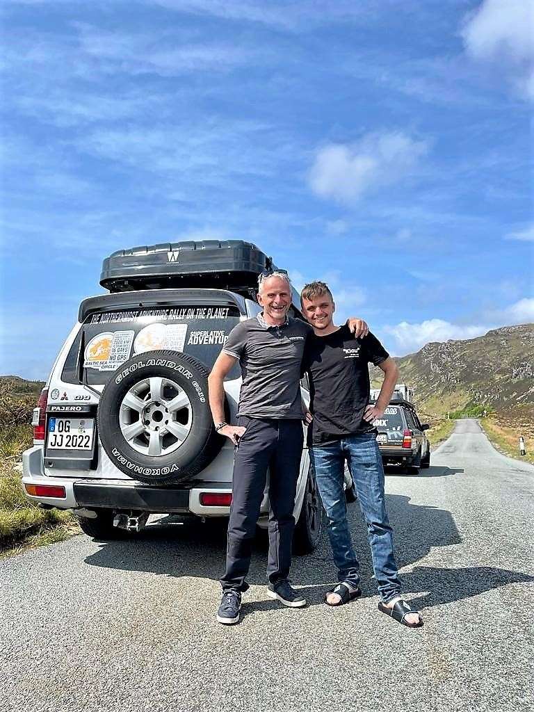 Jan Lammert with his father. They are driving in a converted 2002 Mitsubishi Pajero.