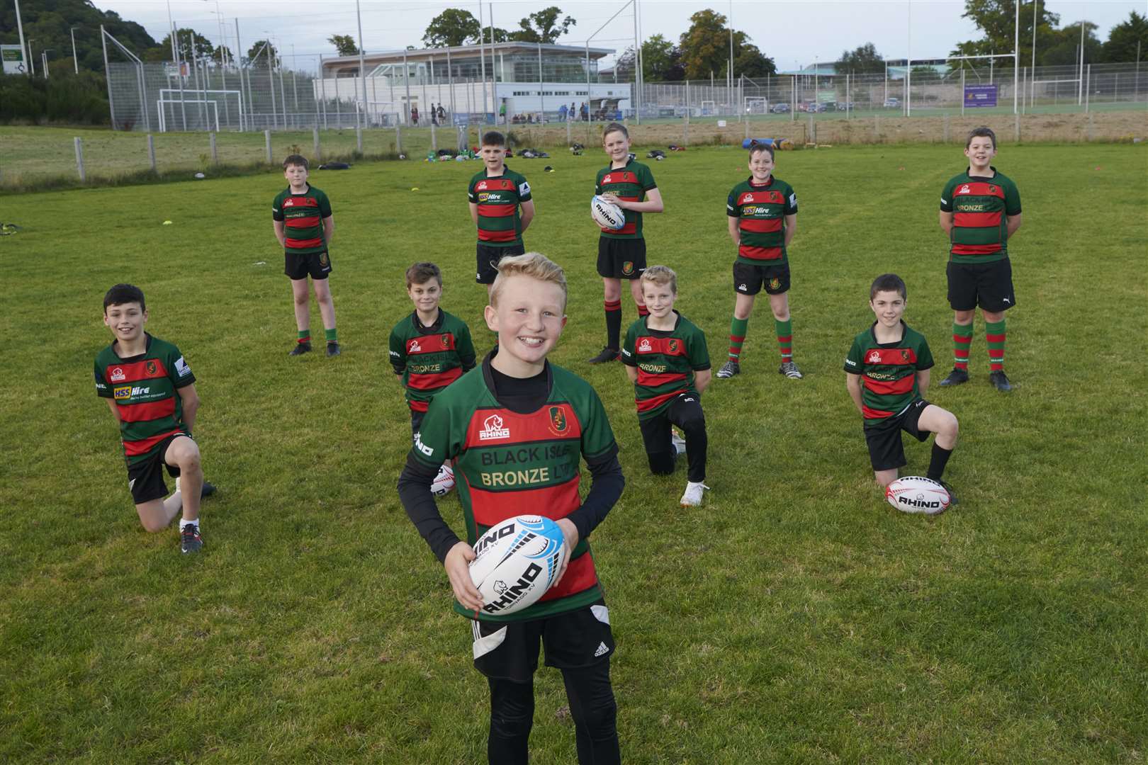 Aldi and Highland Rugby Club sponsorship. LtoR Graham Findlater, President HRC, Neil Malcolm, Aldi and Brian Knowles, Lead Coach Watching the U-13 training session. Front of photo Lachie Sangster (11) and Neil Malcom of Aldi.