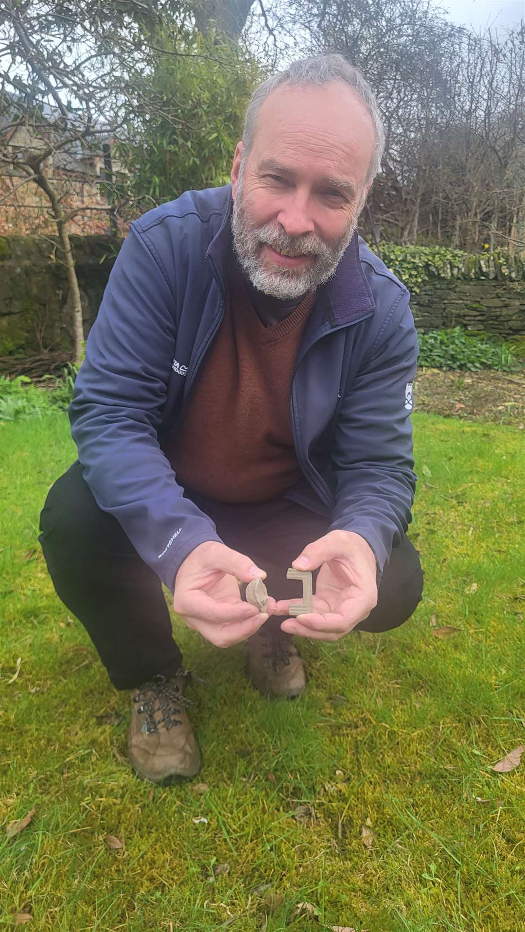 Derek Alexander with the finds. Picture: National Trust for Scotland