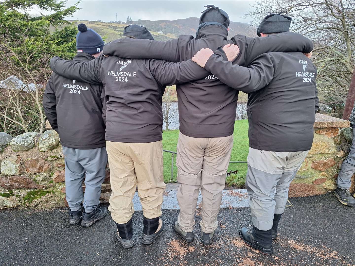 This group of friends from Glasgow are celebrating their tenth year of fishing the Helmsdale. Each year they wear personalised matching jackets and hats with their name, a salmon and 'Helmsdale' printed on them, along with the year.