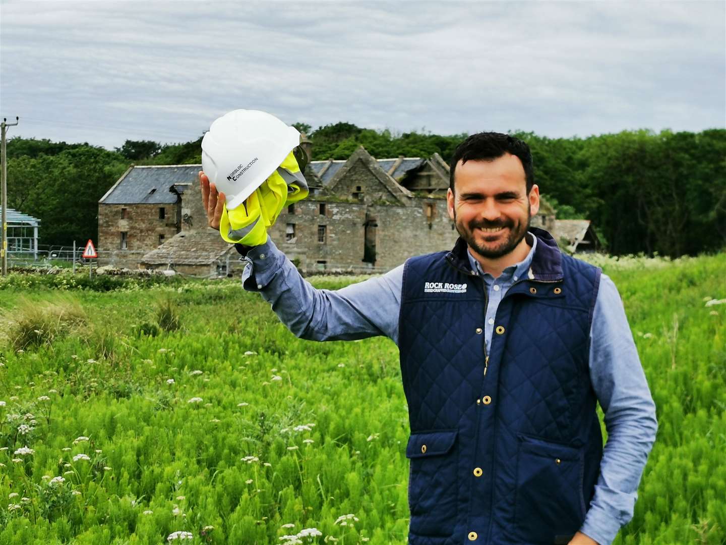 Martin Murray, co-founder and co-director of Dunnet Bay Distillers, with Castletown Mill in the background.