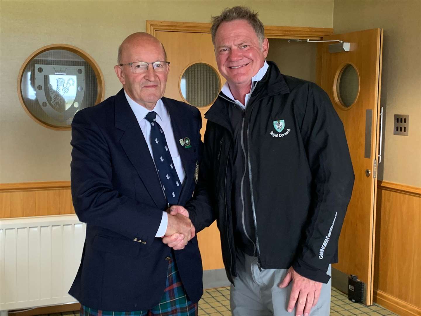 Handicap section winner Cliff Martin is congratulated by club captain Willie MacKay