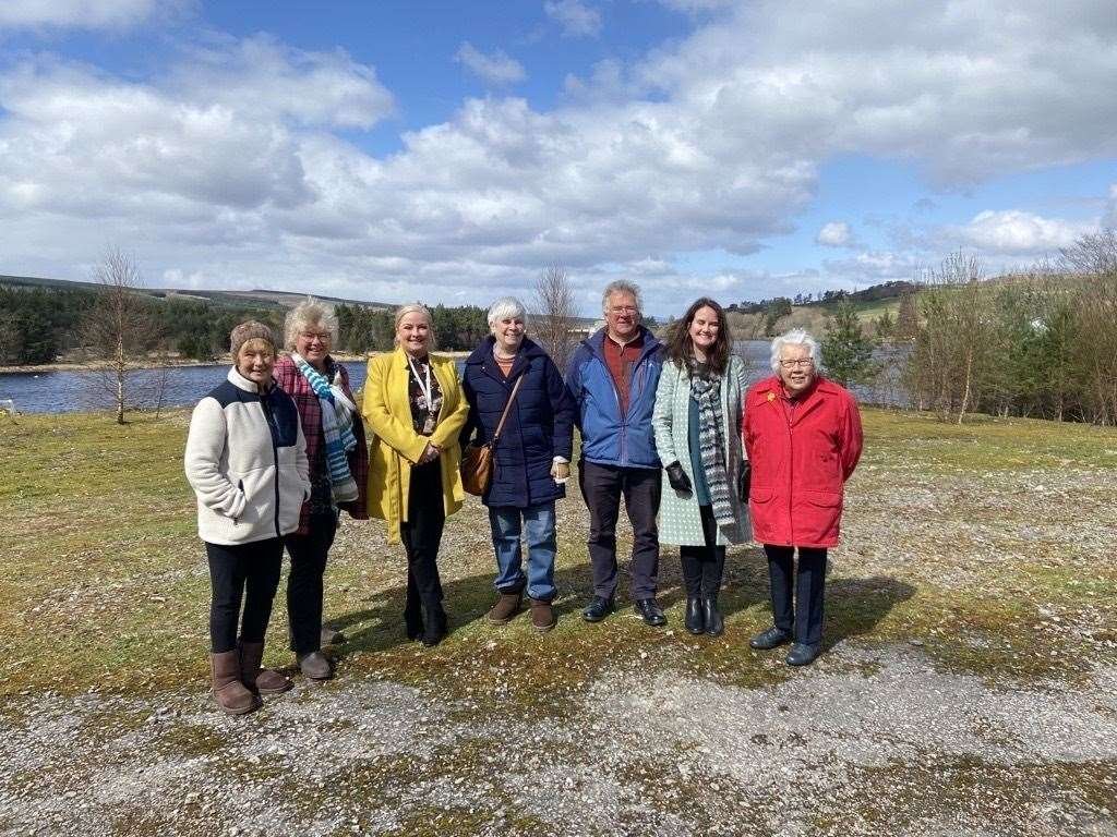 Members of Albyn Housing and Lairg and District Community Initiatives at the site of the planned new housing.