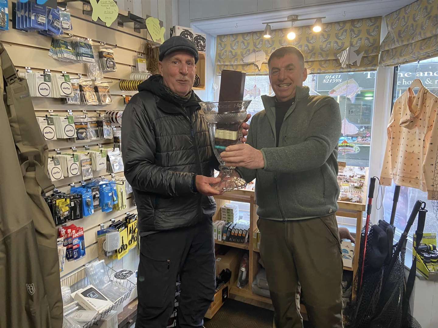 Graham Nichols was presented with the Bridge Hotel Trophy to mark his achievement by Andy Sutherland (Torrish) who caught the first fish last year.