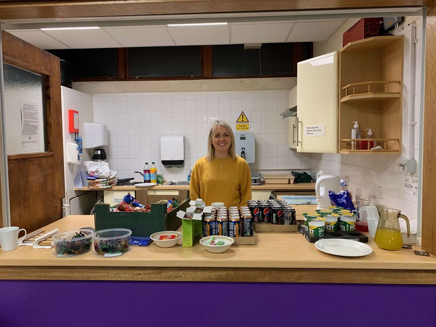 Sessional worker Eilidh Carter gets the soft drinks and snacks ready.