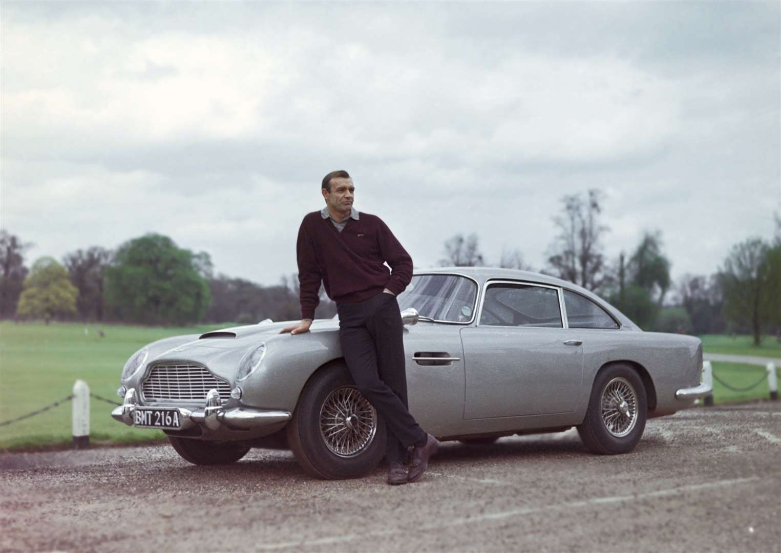 Goldfinger – Sean Connery with Bond's iconic Aston Martin.