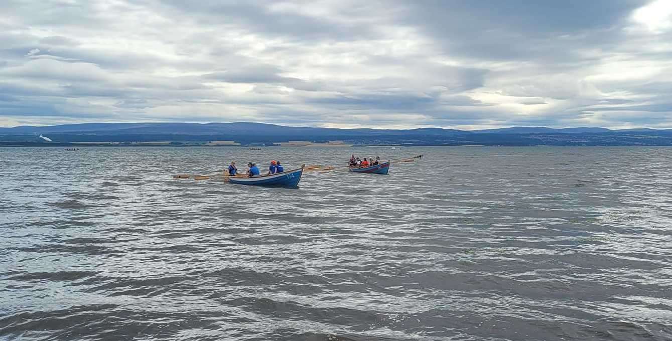 Golspie Rowing Club on the water at the 2022 Avoch Regatta.