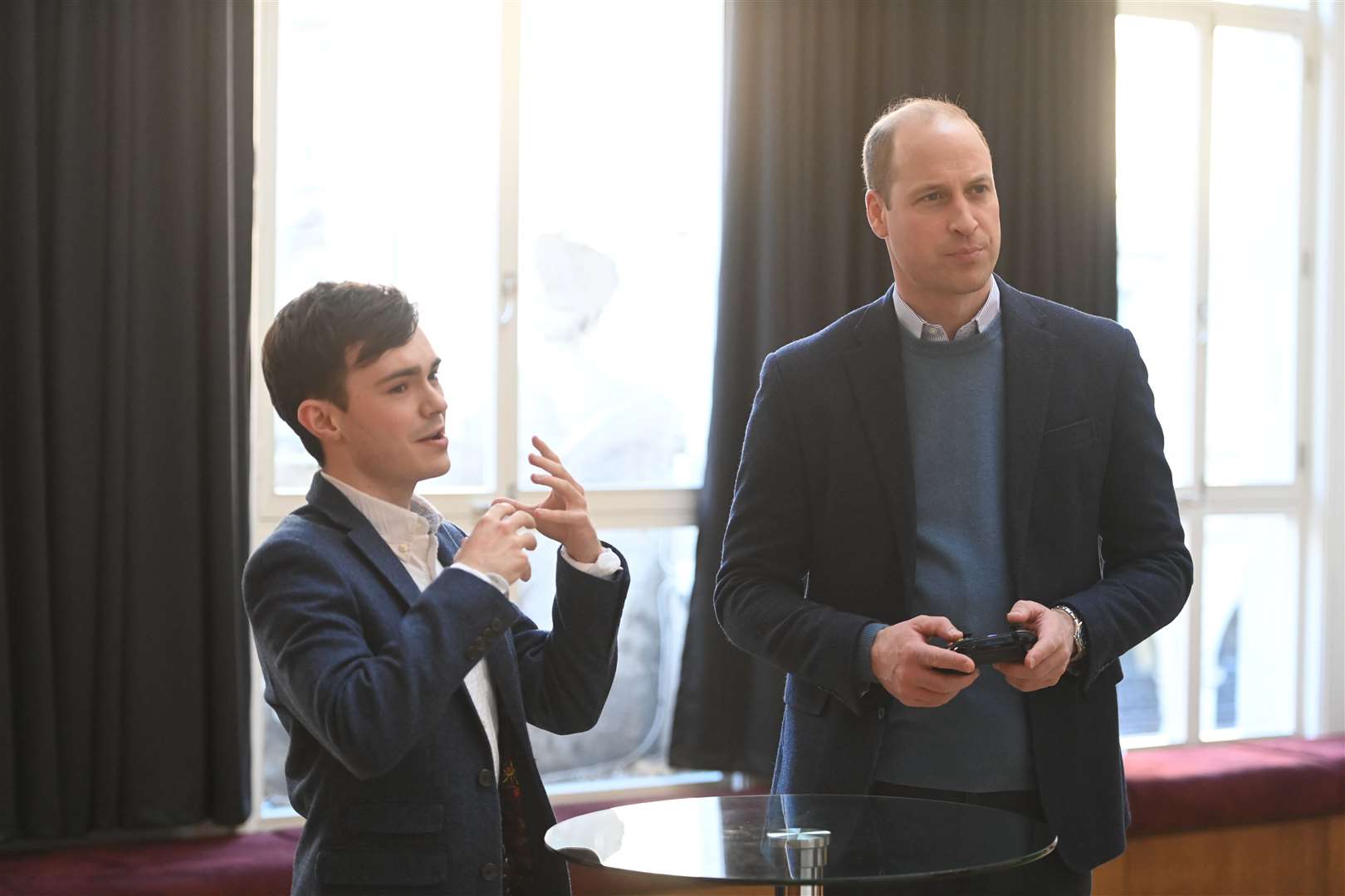 William tries his hand playing a game at Bafta’s HQ (Paul Grover/Daily Telegraph/PA)