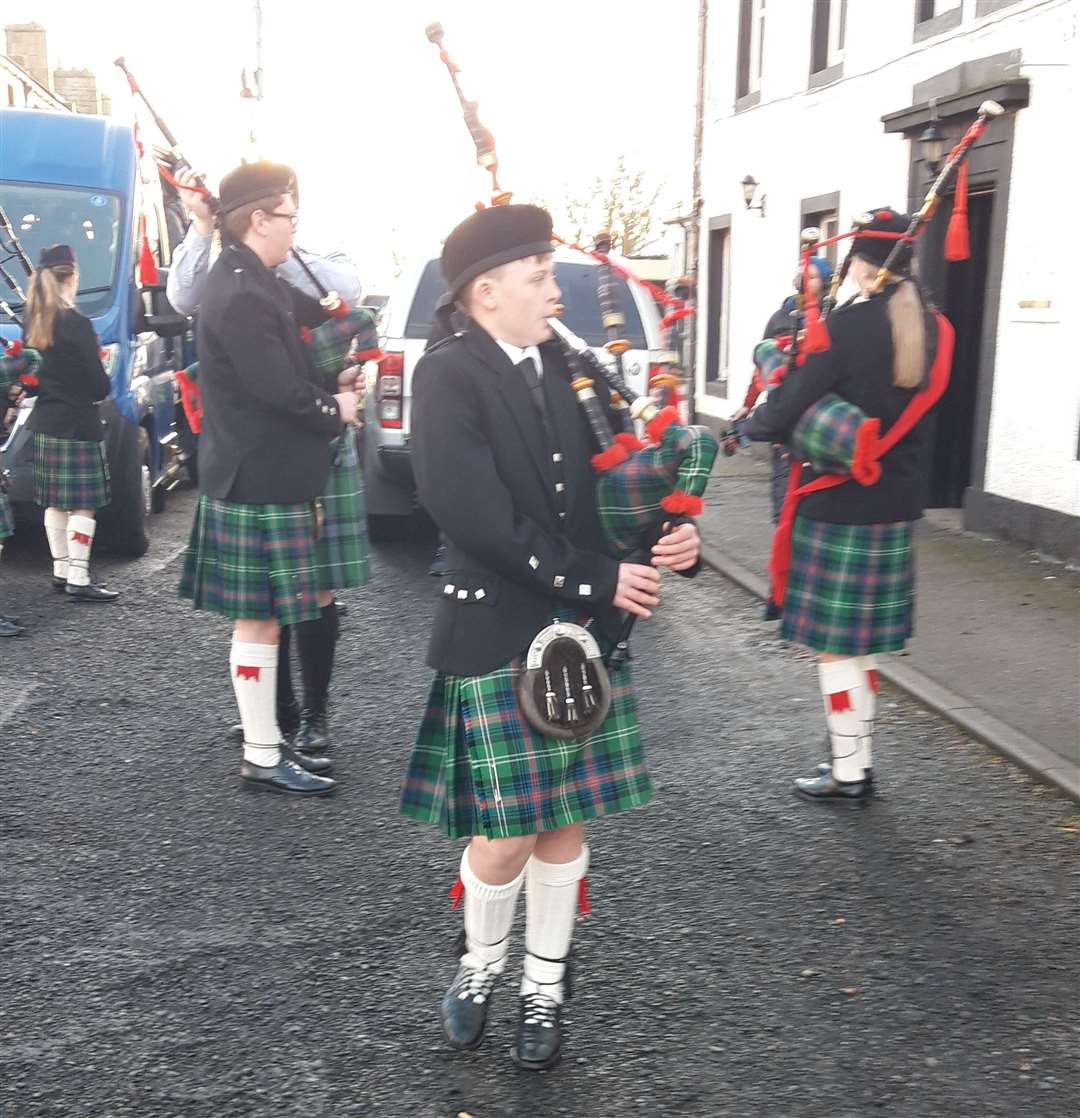 Young pipers tuning up before the parade.