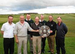 Team captain Neil Hampton, centre, shows off the Dornoch Firth Targe surrounded by his winning team, from left, Alex MacDonald, David Pearson, Daniel Holden, Neil Hampton, John Shepherd, Kevin Matheson and Neil Munro.