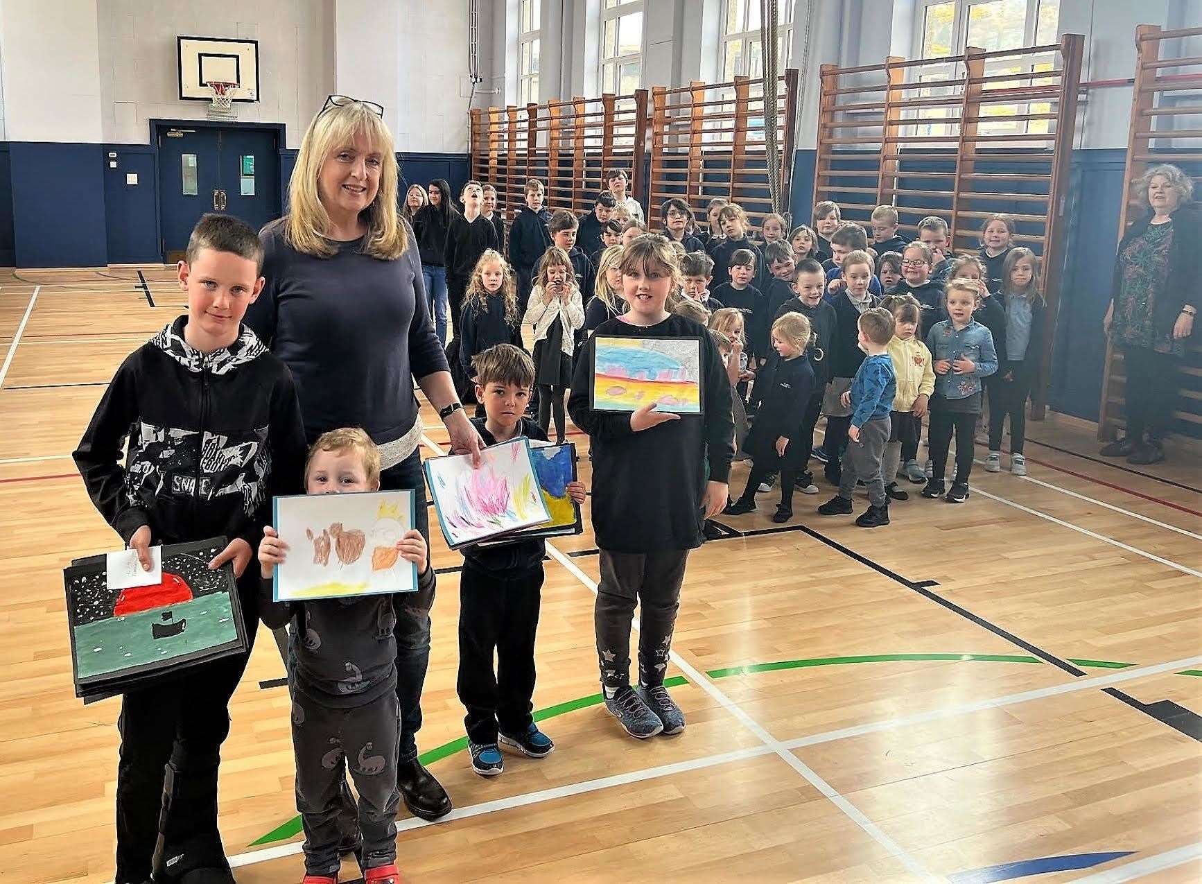 Pupils at Helmsdale Primary School handed their entries to Deputy Lieutenant Catriona Whitfield.