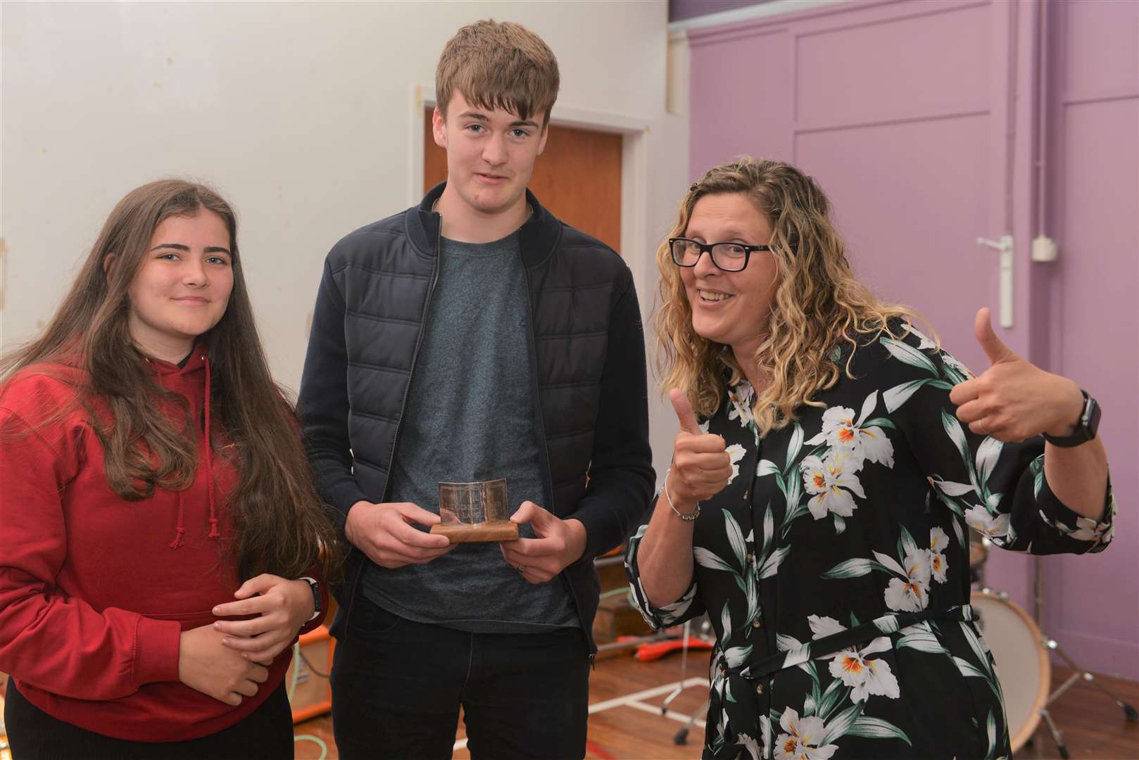 Shannon Robson and Rowan Anderson receive the Liz Dibble Memorial Trophy from French and Spanish teacher Myriam Mackinnon. Picture: Jim A Johnston