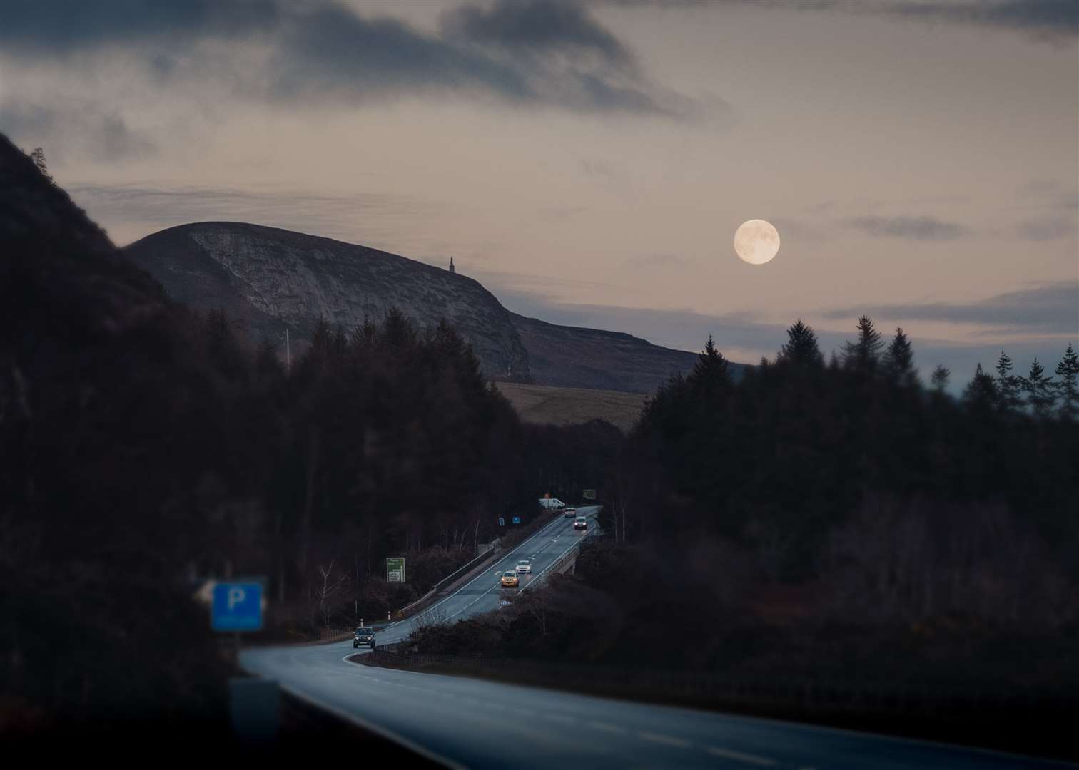 An atmospheric shot by Ewen Pryde, with the moon illuminating the causeway at the Mound and the Duke of Sutherland's statue on the top of Ben Bhraggie.