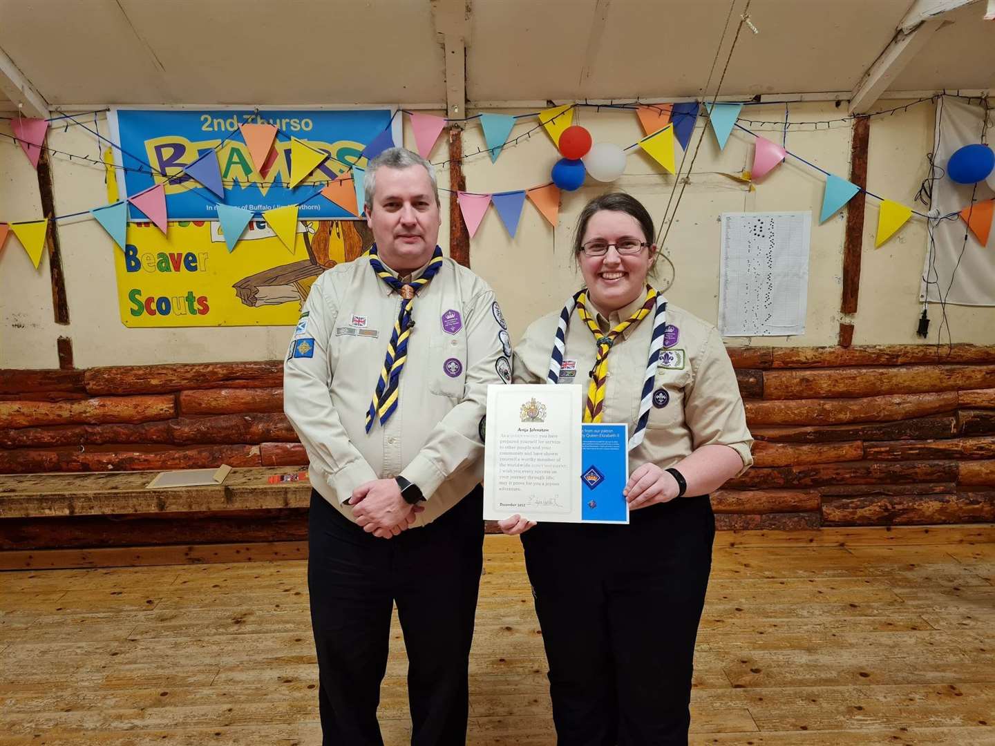 Anja Johnston receives the Queen's Scout Award from Caithness and Sutherland district commissioner Gary Stronach.