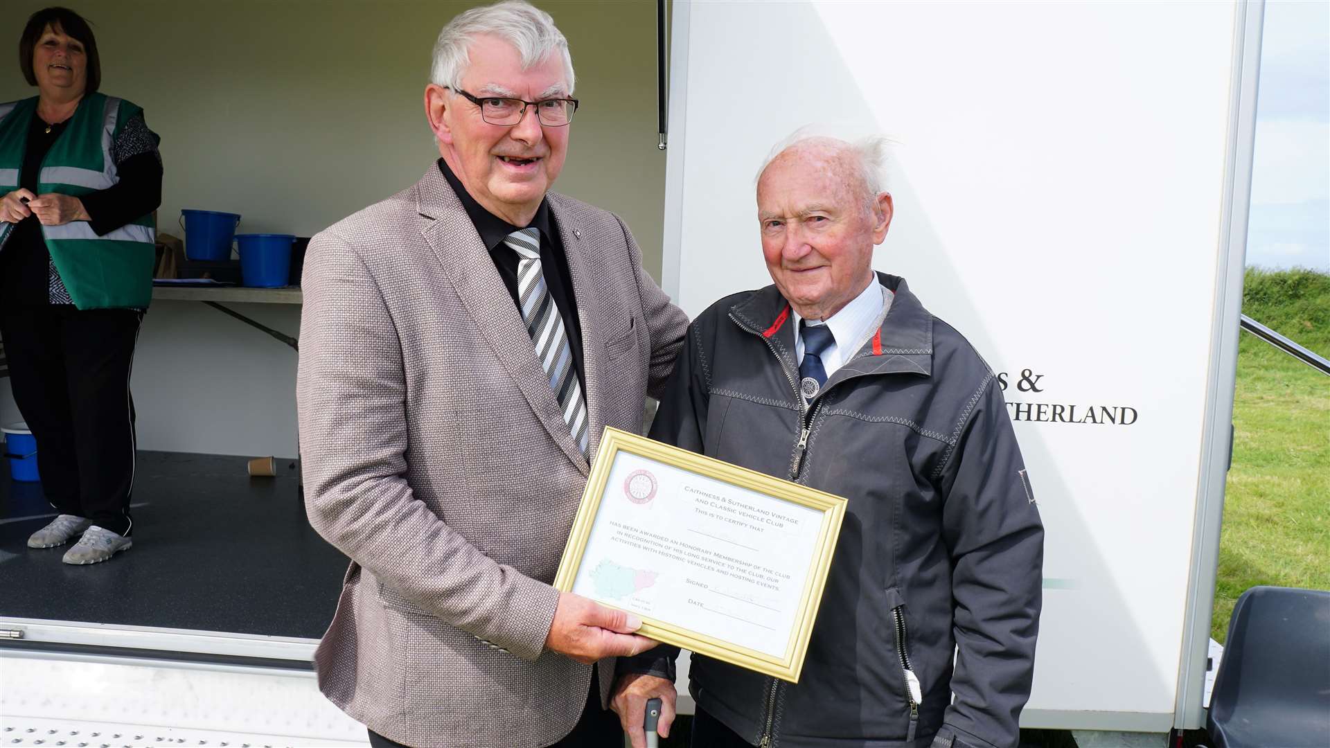 Iain Sutherland, left, gives an honorary award to Edward Mackay from Helmsdale. Picture: DGS