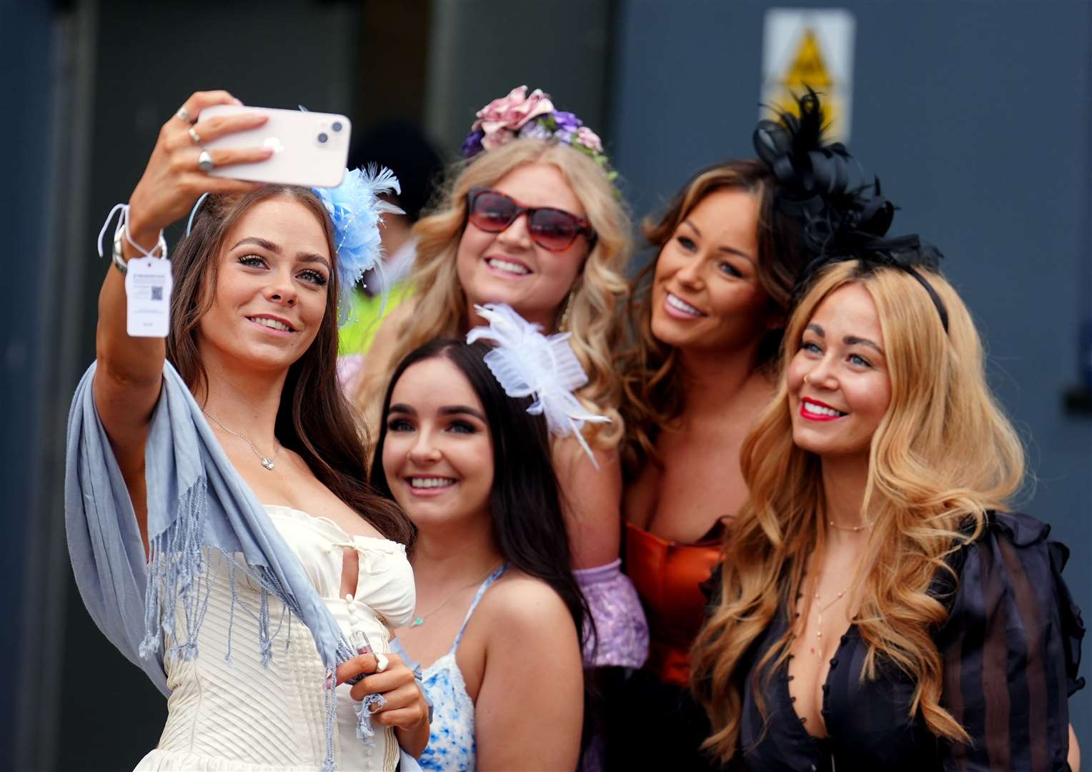 Racegoers take a selfie on day three of the 2024 Randox Grand National Festival at Aintree Racecourse, Liverpool (Mike Egerton/PA)