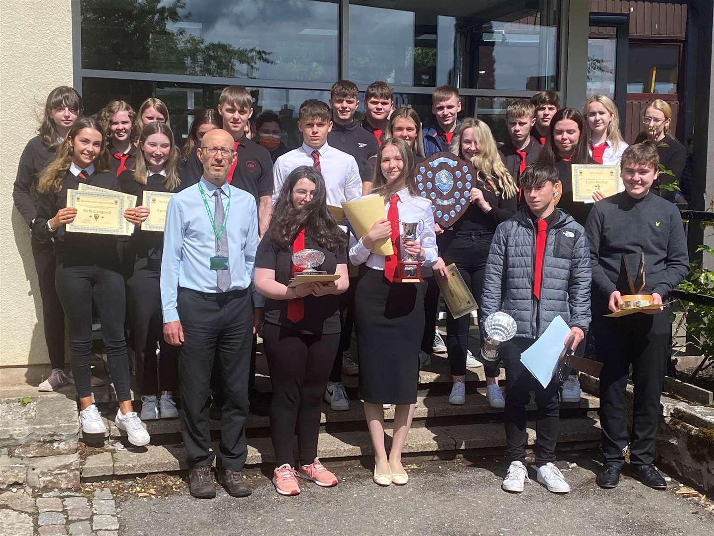 Senior pupils show off their certificates and awards following the prize-giving.