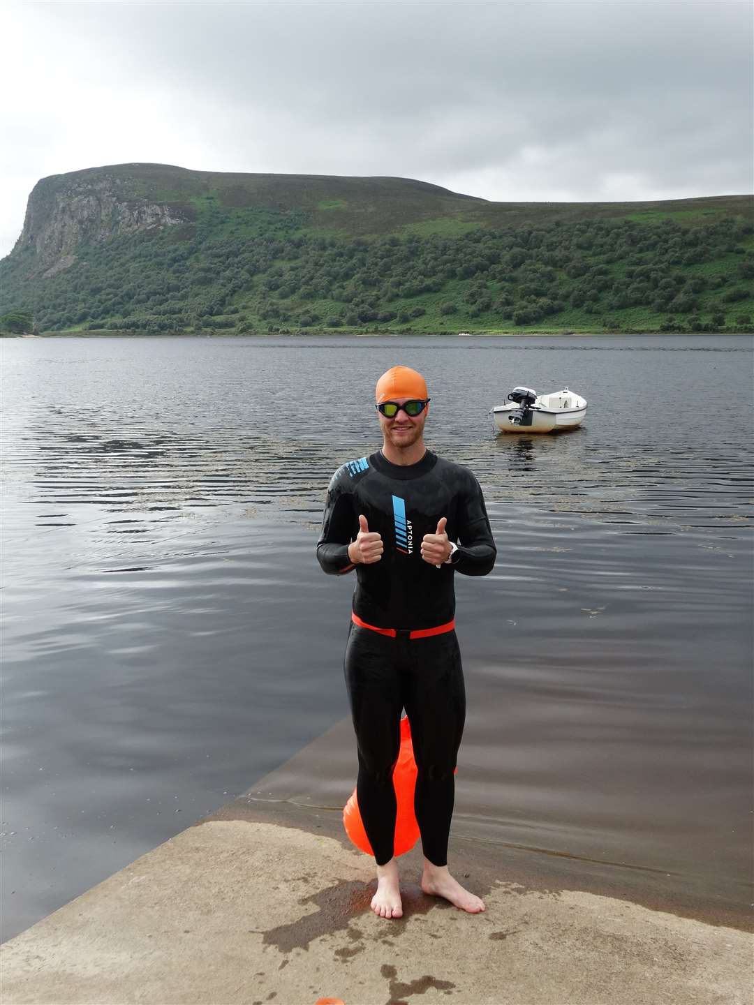 John Mann completed his Tri-7 Challenge, completing seven triathlons in seven days, to raise money for Ross Sutherland Rugby Club and Alzheimer's Scotland.