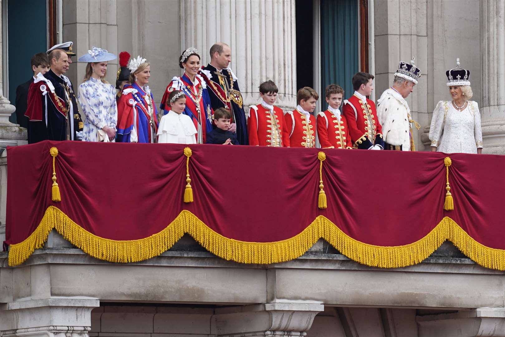 The King and Queen on the Palace balcony with the royal family on coronation day (James Manning/PA)