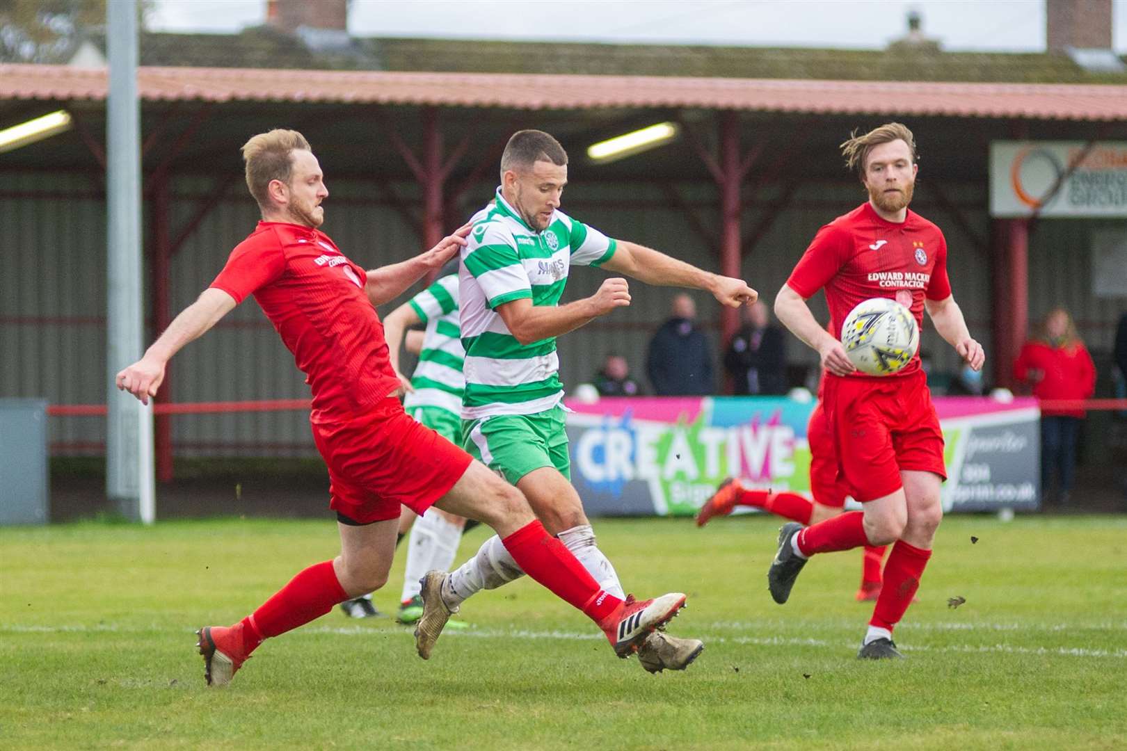 Brora Rangers' centre back Mark Nicolson clears the ball away from Buckie Thistle's Sam Urquhart...Brora Rangers FC (2) vs Buckie Thistle FC (2) - Buckie win 4-3 on penalties - Highland League Cup Semi Final - Dudgeon Park, Brora 18/10/2020...Picture: Daniel Forsyth..