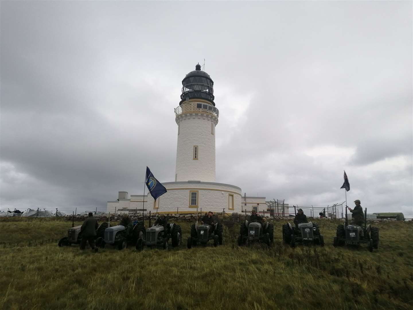The tractors line up at the lighthouse.