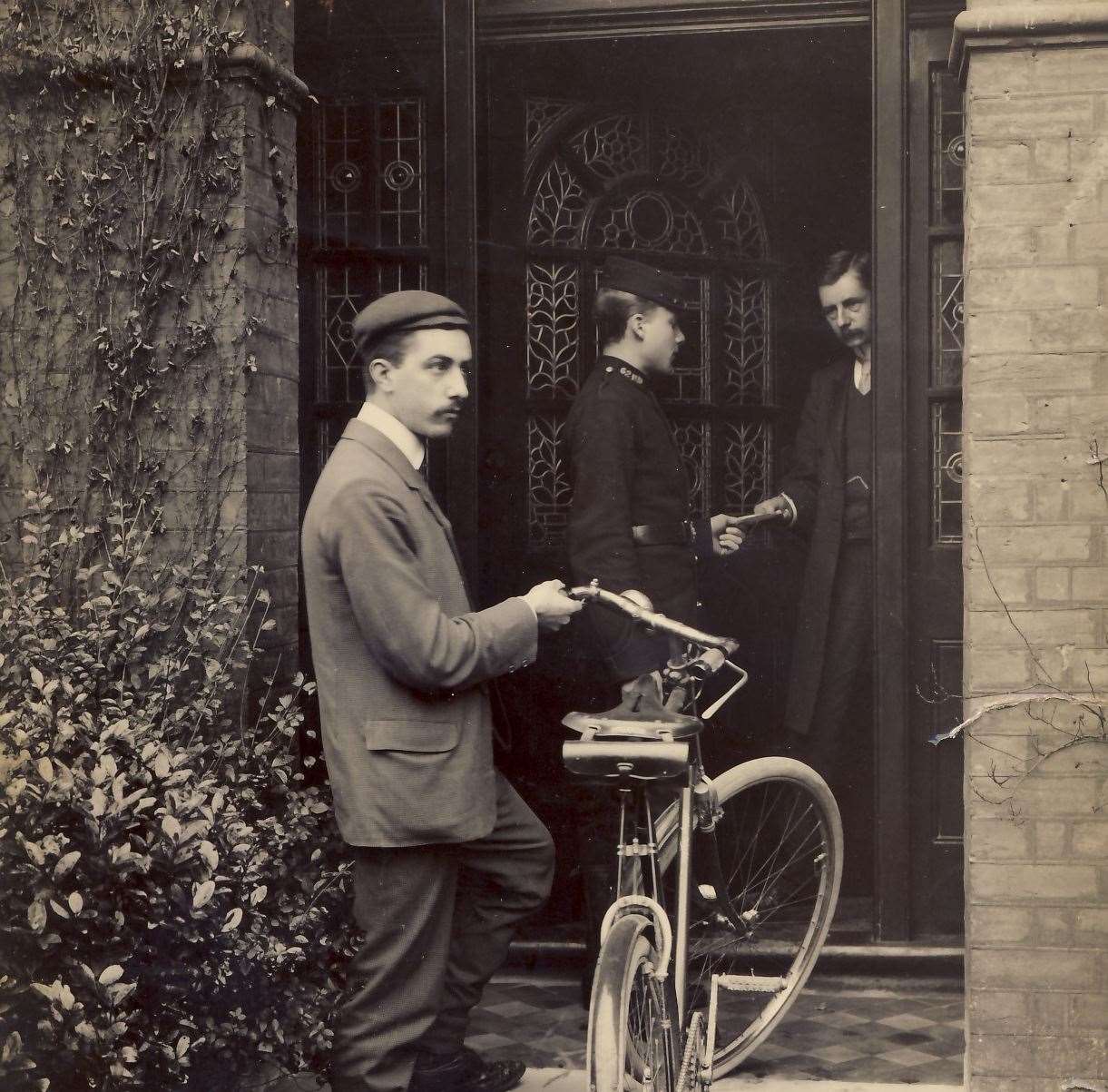 An archive image showing W Reginald Bray being delivered by Royal Mail to his father.
