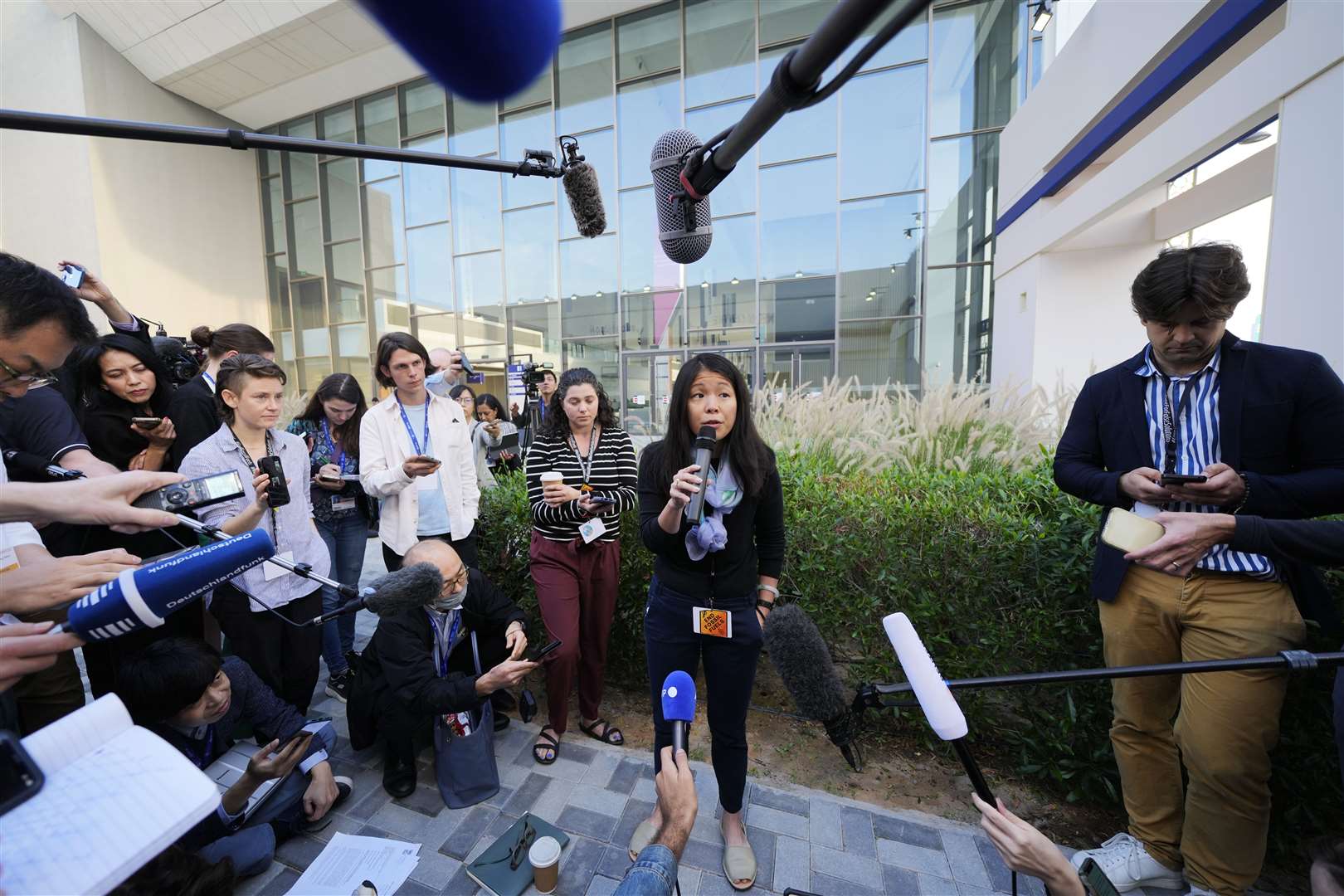 Jean Su from the Centre for Biological Diversity speaks to members of the media about the new text (Kamran Jebreili/AP)