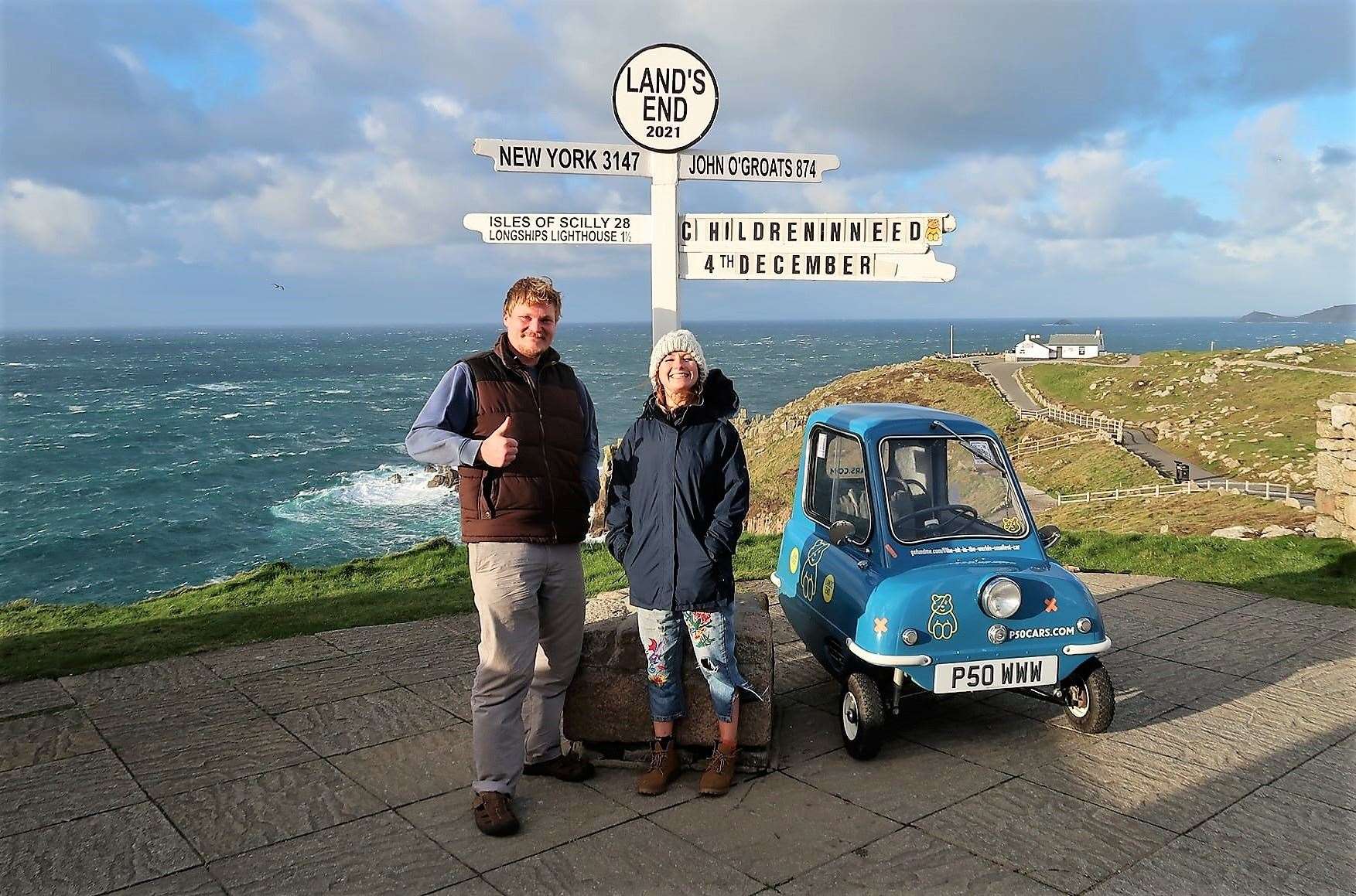 Alex Orchin and Joely Raffle at Land's End with the Peel P50 car
