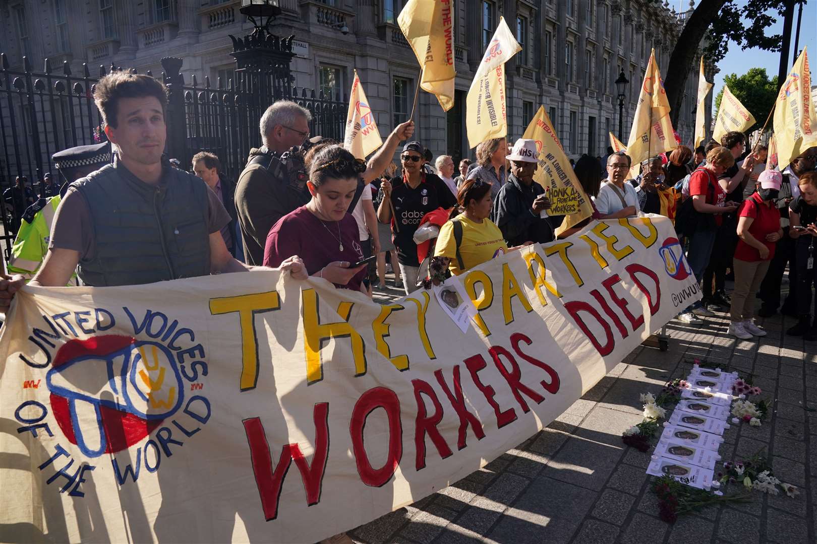 Cleaners stage a protest outside Downing Street in London, following revelations in Sue Gray’s report into parties in Whitehall (Jonathan Brady/PA)