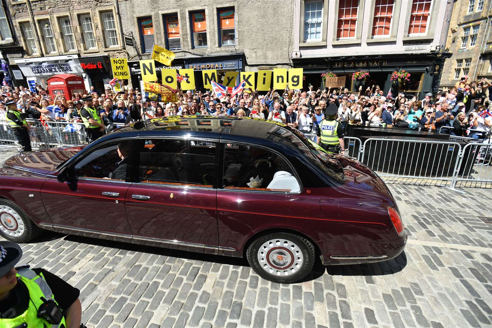 Protesters held banners saying ‘Not My King’ as the procession made its way up the Royal Mile (Mark Runnacles/PA)