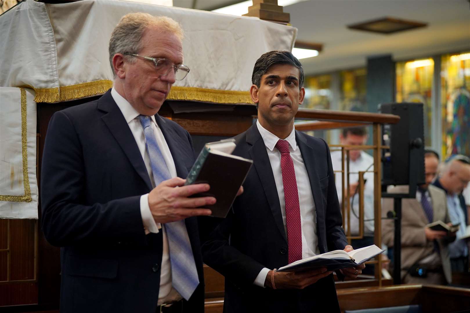 Prime Minister Rishi Sunak visited a synagogue on Monday to join in with prayers for victims of the Hamas attack (PA)