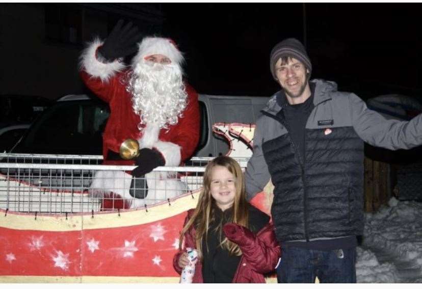 Philip Rodgers and young Kelsey braved the cold to meet Santa.