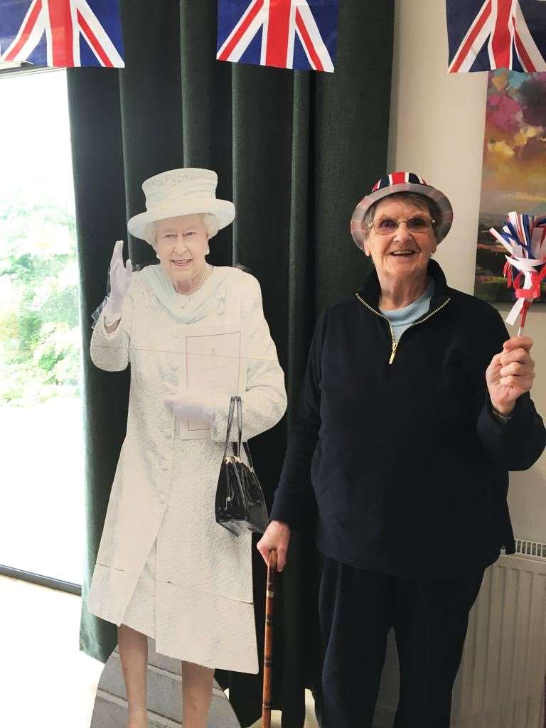 Beth Robertson, from Ardgay, poses beside a cardboard cut-out of the Queen.