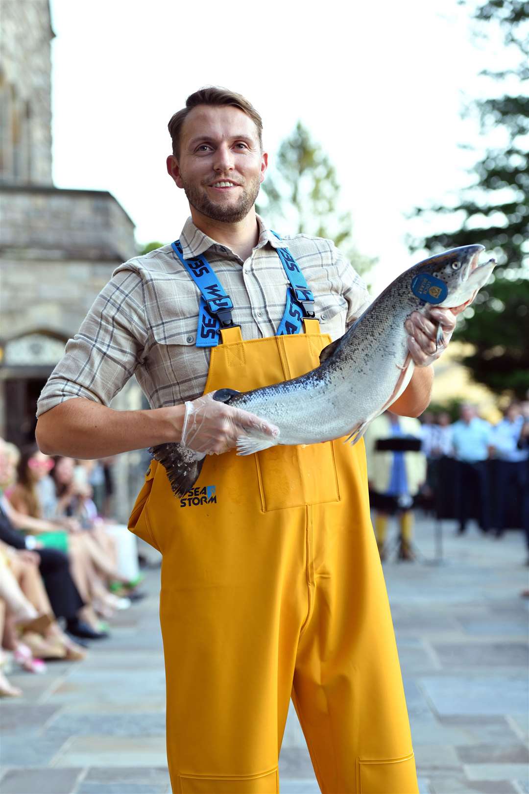 Loch Duart was represented at the Dressed to Kilt event by Adam Gray, marketing and communications manager. He is seen here dressed in farming gear and holding a Loch Duart salmon.
